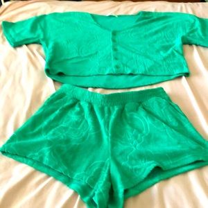 Two piece top is size small.    The matching shorts are a medium